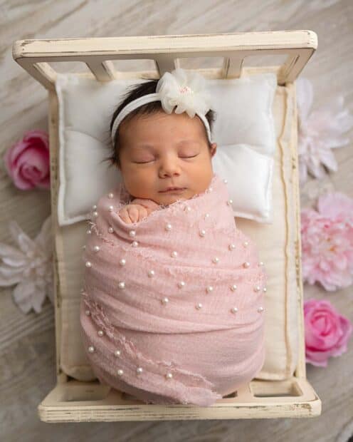 Toledo Newborn Photographer Baby in pink baby bed